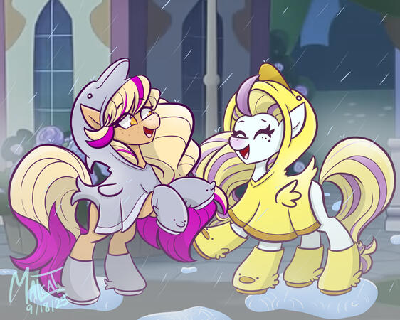 Bailey and Finley from Wild Manes playing in the rain. Bailey is wearing a dolphin poncho, and Finley is wearing a ducky poncho.